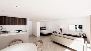 a living room with a couch and a table at Lakeside Studios Konstanz in Konstanz