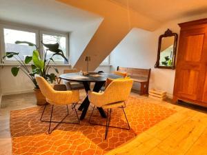 a dining room with a table and chairs at La Fornaccia in Anloo