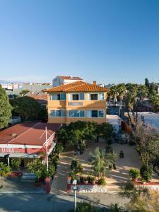 an aerial view of a building with a parking lot at Hostel Casa La Cha in Novalja