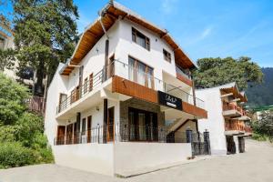 a white building with a sign that reads hotel at Collection O Mall Road Nainital Formerly Urban Bliss in Nainital