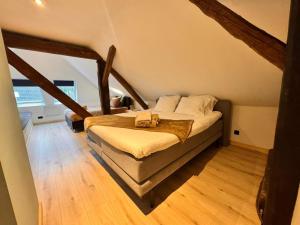 a bedroom with a bed in a attic at La Fornaccia in Anloo