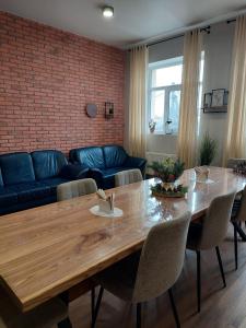 a living room with a table and a couch at Hotel GLORIA in Ceadîr-Lunga