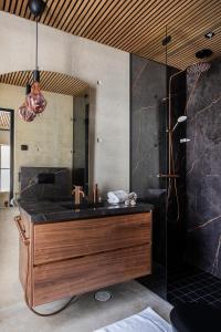a bathroom with a sink and a shower at Taikavilla in Kuusamo +13 photos