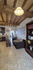 a living room with a couch and a table at Il Castello di Monteggiori in Camaiore