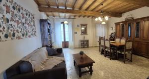 a living room with a couch and a table at Il Castello di Monteggiori in Camaiore