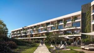 a building with a garden in front of it at Icona's Costa Ragusa Resort - New Opening in Scoglitti