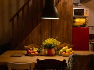 a table with two baskets of fruit on it at Sicily Private Pool House in Nature in Montargano +3 photos