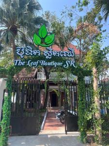 a sign at the gate of the reef boutique hotel at Leaf Boutique SR in Siem Reap +9 photos