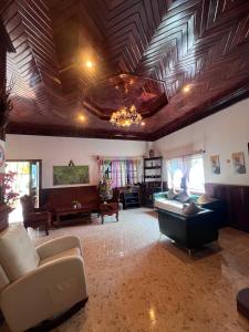 a living room with a couch and a table at Leaf Boutique SR in Siem Reap