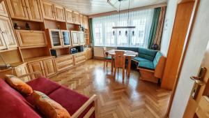 a living room with a couch and a table at Vintage Apartment in Graz