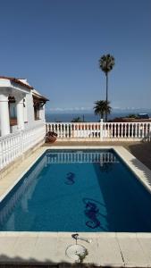 a swimming pool in front of a house at Holiday Feel - La Orotava in La Orotava