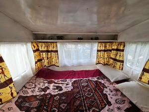 a small bed in the back of a trailer at Ubuntu Backpackers in Umtali