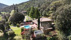 an aerial view of a house in a mountain at Les Brugas de Camias in Saint-André-de-Majencoules