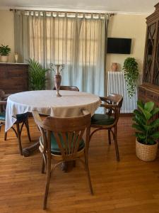 a dining room with a table and some chairs at Aegli Hotel in Perama