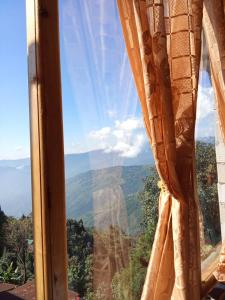 a view of the grand canyon from a window at Rainbow Guest House in Sonāda +10 photos