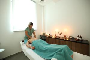 a woman in a hospital room with a patient at Terme BANJA LUKA in Banja Luka