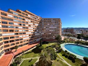 a view of two large buildings and a swimming pool at Estudio con piscina in Roses