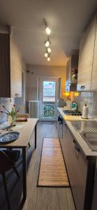 a kitchen with a table and a counter top at Casa di Clara in Sulmona