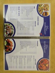 a menu for a restaurant with three plates of food at Hotel Akashdeep in Kolkata