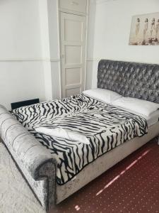 a bed in a room with a zebra print mattress at Teeside Port in Middlesbrough in Middlesbrough