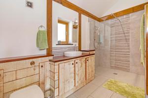 a bathroom with a sink and a shower at Amber Lodge in Ashover