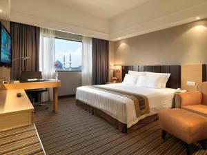 Postel nebo postele na pokoji v ubytování Concorde Hotel Shah Alam