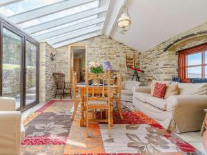 a living room with a glass ceiling and a table at 3 Bed in Consett oc-cn195 in Hunstanworth