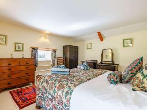 a bedroom with two beds and a dresser at 3 Bed in Consett oc-cn195 in Hunstanworth