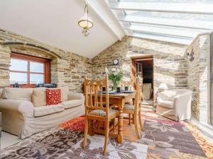 a living room with a table and a couch at 3 Bed in Consett oc-cn195 in Hunstanworth +14 photos