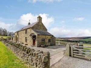 an old stone house with a stone wall at 3 Bed in Consett oc-cn195 in Hunstanworth