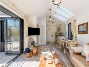 a living room with a couch and a table at 1 Bed in Wareham oc-87150 in Stoborough
