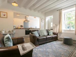 a living room with a couch and a table at 2 Bed in Leyburn oc-75441 in West Burton