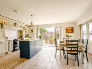 a kitchen and dining room with a table and chairs at 3 Bed in Ilminster oc-77987 in Cudworth