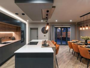 an open kitchen and living room with a dining room at 4 Bed in Morpeth oc-95889 in Amble