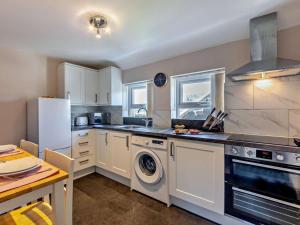 a kitchen with a washer and dryer at 1 Bed in Alnwick oc-94380 in Embleton