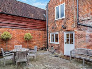 a patio with a table and chairs and a building at 3 Bed in Stockbridge oc-94143 in Broughton