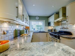 a large kitchen with a large marble counter top at 3 Bed in Wooler oc-93544 in Wooler