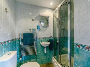 a bathroom with a shower and a toilet and a sink at 3 Bed in Wooler oc-93544 in Wooler +20 photos