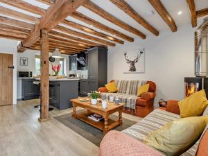 a living room with a couch and a table at 3 Bed in Salisbury oc-66130 in Redlynch