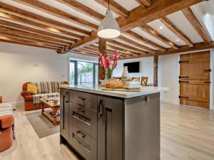 a kitchen with an island in the middle of a living room at 3 Bed in Salisbury oc-66130 in Redlynch