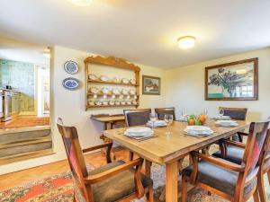 a dining room with a wooden table and chairs at 4 Bed in Consett oc-cn108 in Hunstanworth