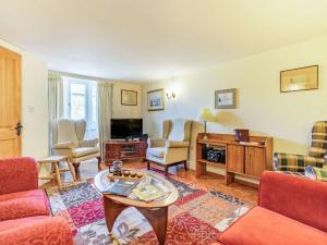 a living room with a couch and a table at 4 Bed in Consett oc-cn108 in Hunstanworth