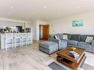 a living room with a couch and a table at 2 Bed in Sandown oc-83617 in Sandown