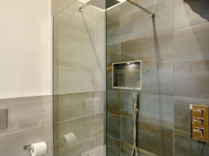 a shower with a glass door in a bathroom at 4 Bed in Skipton oc-84017 in Rylstone +12 photos
