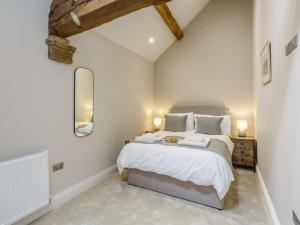 a bedroom with a large bed in a attic at 4 Bed in Skipton oc-84017 in Rylstone