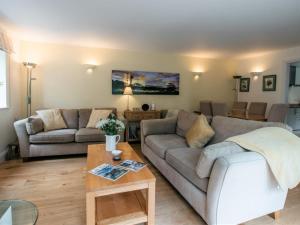 a living room with a couch and a table at 3 Bed in Bedale oc-g0095 in Crakehall