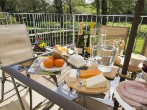 a glass table with fruit and cheese on a balcony at 3 Bed in Bedale oc-g0095 in Crakehall