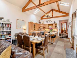 a kitchen and dining room with a table and chairs at 3 Bed in Beadnell oc-cn037 in Beadnell