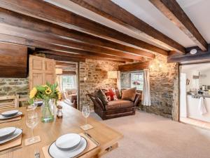 a living room with a table and a couch at 2 Bed in Bishop Auckland oc-93111 in Westgate