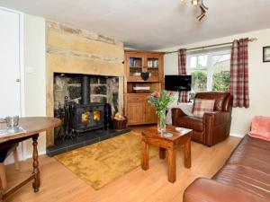 a living room with a fireplace and a couch at 1 Bed in Hexham oc-89085 in Bellingham